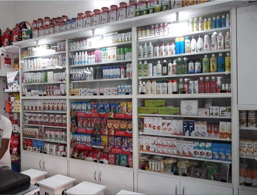 Shelves of pet food and care products at PETiSM
